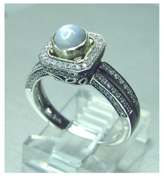Ladies 14kt. white gold Ceylon intense grey blue star sapphire and diamond halo ring
