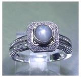 Ladies 14kt. white gold Ceylon intense grey blue star sapphire and diamond halo ring