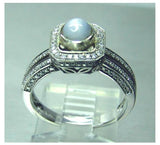 Ladies 14kt. white gold Ceylon intense grey blue star sapphire and diamond halo ring